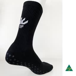 A black sock with a ribbed design and textured grip dots on the sole. It features a logo on the side.
