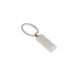 A shiny silver 3D metal key ring with a rectangular tag featuring a raised design, attached to a circular keyring.