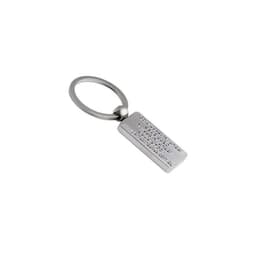 A metallic key ring with a rectangular tag featuring embossed text and a circular attachment loop.