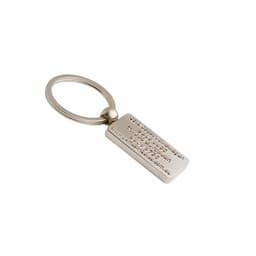 A metallic silver key ring with a rectangular tag featuring an embossed design and a circular attachment loop.