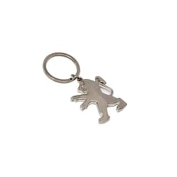 A metallic key ring in the shape of a dog, attached to a circular keychain.