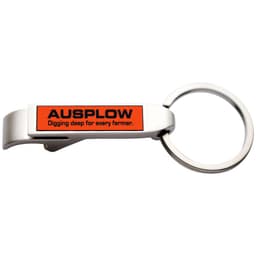 A metal key ring in silver with an orange and black logo on the side.
