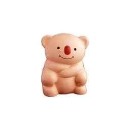 A light beige koala-shaped stress toy with a smiling face and a red nose, featuring a simple design.