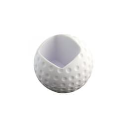 A white golf ball-shaped mobile phone holder with a textured surface and a hollow section for holding a phone.