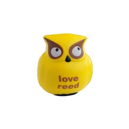A yellow stress owl with large eyes and brown accents, featuring the word "reed" on its body.