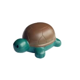 A stress-relief toy shaped like a turtle, featuring a brown shell and green body. Includes a simple logo.