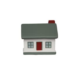 A grey and white house-shaped product with a red door and a chimney, featuring four windows.