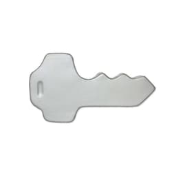 A silver key-shaped stress reliever with a smooth surface and a logo on it.