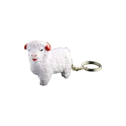 A white sheep-shaped keyring with red details attached to a metal keyring.