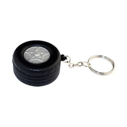 A black tyre-shaped keyring with a metallic centre, featuring a silver keychain attachment.