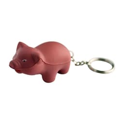A pink pig-shaped keyring featuring a keychain attachment. The pig is made of soft material.