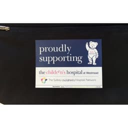 A black travel sports bag featuring a logo and a support badge for a children's hospital.