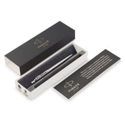 A brushed stainless steel ballpoint pen in a black box with a branded interior, alongside an information card.