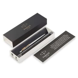 A metal ballpoint pen in brushed stainless steel with a gold-tone clip, presented in a black and white box.