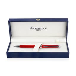 A metal ballpoint pen in comet red, presented in a navy blue box with a soft interior and a branding logo.