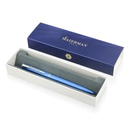 A blue metal ballpoint pen displayed in a grey-lined box, featuring a logo on the packaging.
