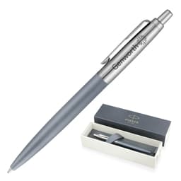 A matte grey ballpoint pen with a silver clip and a branded box.