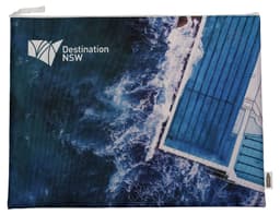 A zippered bag featuring a blue ocean wave design, with an aerial view of a swimming pool and a logo.