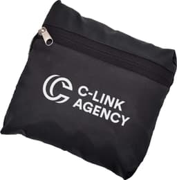 A black travel bag with a zip closure and a logo on the front, compactly folded.