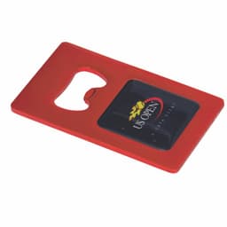 A red bottle opener keyring featuring a black panel with a logo. It has a rounded cutout for opening bottles.