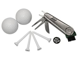 A grey multi-tool, two white golf balls, four white tees, and a brush with a logo.