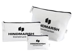 A set of three white bags with black zippers and a logo, varying in size.