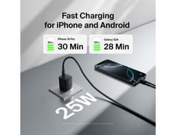 A black 25W wall charger with a cable connected to a smartphone on a sleek surface, featuring a logo.