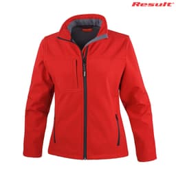 A red Ladies Classic Softshell Jacket with a zip closure and a logo on the upper right.