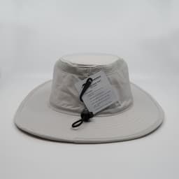 A light grey sun hat with a wide brim, featuring a chin strap and a label attached.