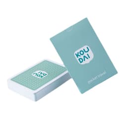 A deck of playing cards in a mint green box with a logo, featuring a dotted design on the card back.