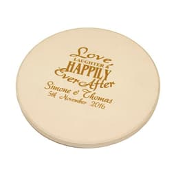 A round, beige absorbent stone coaster featuring engraved decorative text and a branding logo.