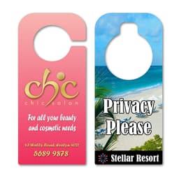 Two door hangers: one pink with gold logo and text for a salon, the other featuring a beach scene with a privacy message.