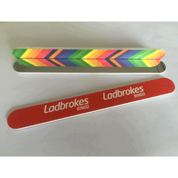 An emery nail file with a mirror, featuring a colourful chevron design and a branded red casing.