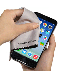A hand using a grey microfibre lens cloth to clean a smartphone screen. The cloth features a logo.