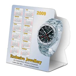 A table tent featuring a silver watch and a calendar for the year 2009, with a logo at the bottom.