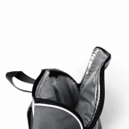 A grey picnic backpack with a zippered opening, featuring an insulated interior for food and drinks.