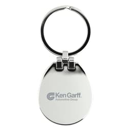 A silver keychain with a circular ring and an egg-shaped body, featuring a logo on one side.