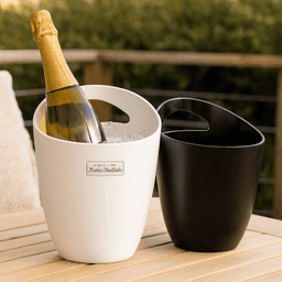 A white and black ice bucket pair, one holding a bottle of champagne surrounded by ice. Each bucket has a handle.