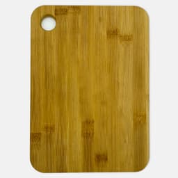 A large bamboo cutting board with a round hole in one corner, featuring a natural light brown finish.