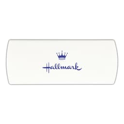 A cream-coloured bandage dispenser with a blue logo and crown graphic.