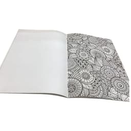 An open A4 colouring book featuring intricate black and white floral patterns on one page, with a blank page on the other.