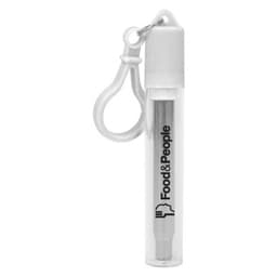 A clear case containing a silver telescopic stainless steel straw with a white cap and a keychain clip.