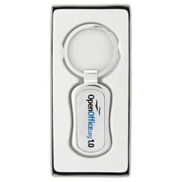 A silver keychain with a rounded rectangular design inside a white box, featuring a logo.
