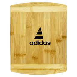 A bamboo cutting board featuring a sleek design with a logo. The board has a natural finish with a smooth surface.
