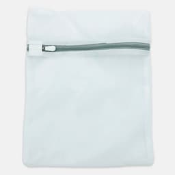 A white mesh laundry bag with a zip closure and a simple design, featuring a logo on the front.
