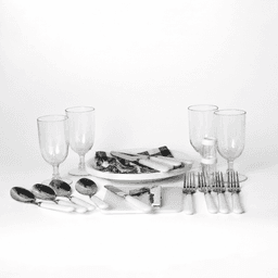 A picnic set features white-handled cutlery, glass tumblers, and serving platters on a white background.