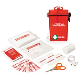 A waterproof red first aid kit containing various bandages, wipes, scissors, and adhesive tape.