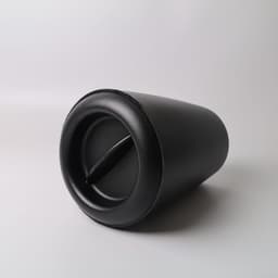 A black ice bucket with a sleek design, featuring a side opening and curved shape. It has a branding logo.