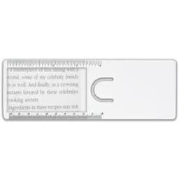 A clear magnifier ruler features a rounded cut-out and printed measurement markings, ideal for reading and measuring.