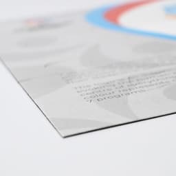 A magnetic jigsaw puzzle, featuring a colourful design with blue, red, and grey elements, showcasing a logo.